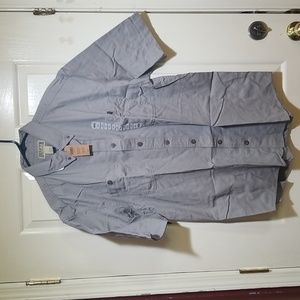 Duluth Men's short sleeve denim shirt Color is Pewter
